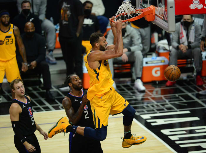 Rudy Gobert (27) has a major dunk over Kawhi Leonard (2) and Luke Kennard (5)
